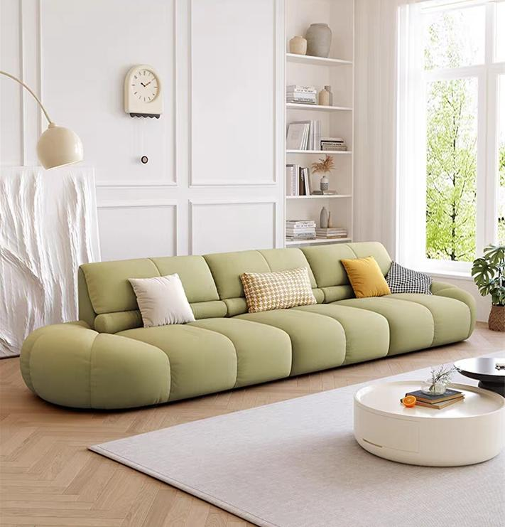 The Nordic cream style fabric sofa for small modern minimalist living room. Designer's new model of straight row pumpkin sofa.