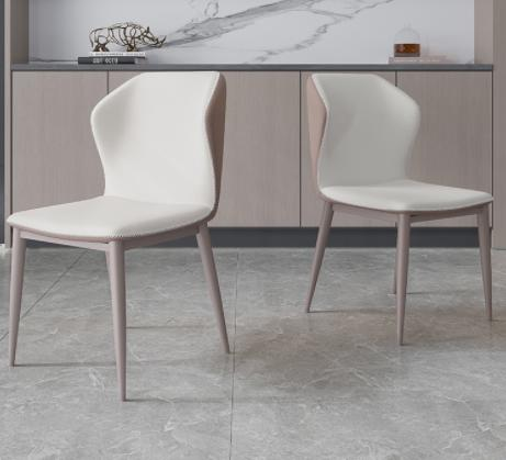 New model Italian-style high-end luxury dining chair for home use. Modern minimalist leather-backed iron-wrought upholstered chair.