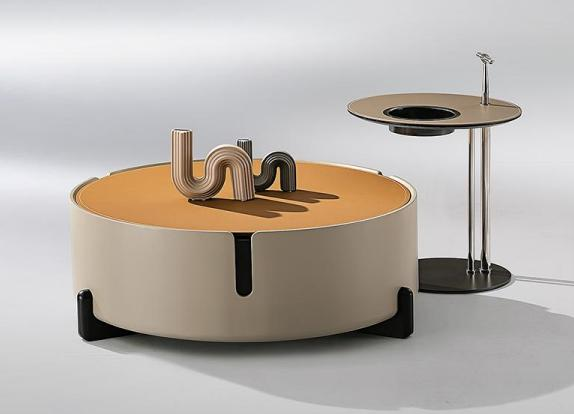 Minimalist round saddle leather coffee table set with matte finish for small-sized apartments, designed by a senior designer, featuring an elegant artistic look.
