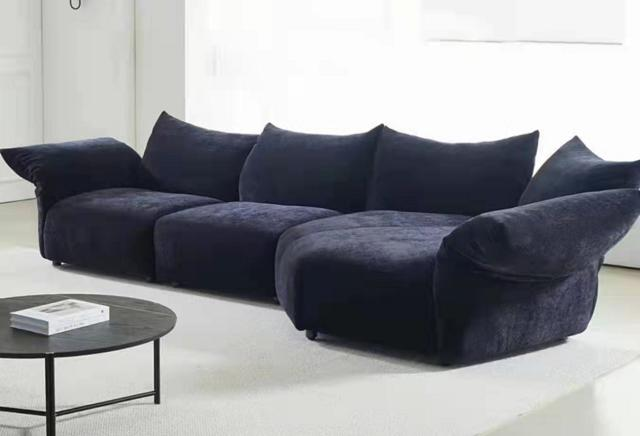 Fabric sofa in Italian style with petal-shaped cushions, adjustable design, and a stylish corner turner.