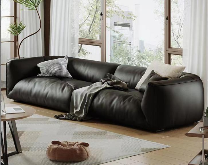 Minimalist genuine leather puffed sofa, top-grain cowhide, black, chubby, tofu-shaped, retro style.