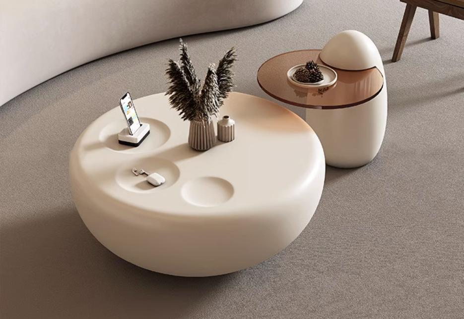 French cream style cat paw coffee table for small-sized living room in modern minimalist style, designed by a designer, featuring a trendy round shape, suitable for home use.