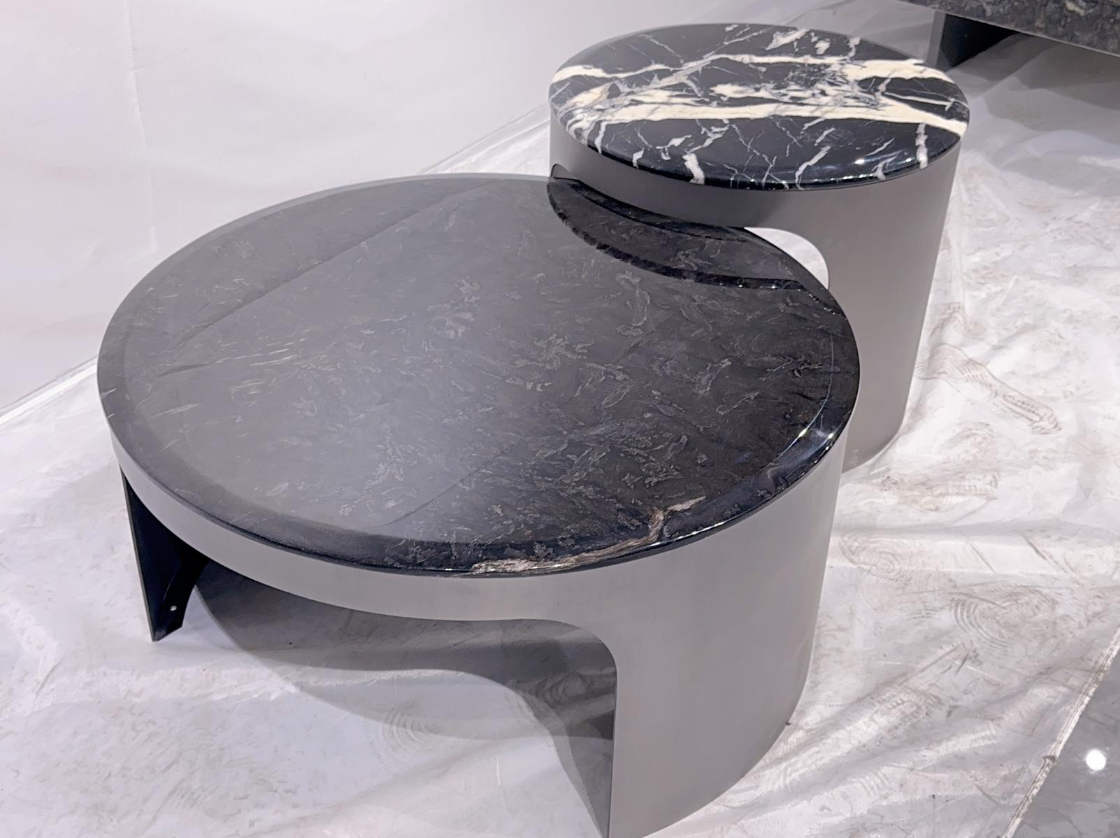 Modern minimalist luxury marble and stainless steel coffee table set for small-sized living room with a simple round coffee table design.