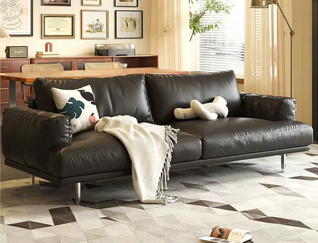 Leather sofa for small living room with retro cream style and three-person seating arrangement in straight row, in caramel color. It is suitable for a cozy and vintage atmosphere.