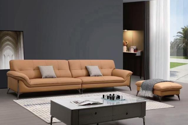 Vintage leather sofa for small-sized modern living room with straight row layout. Antique-style furniture.