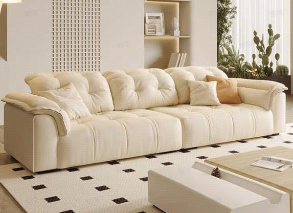 Cream-colored cat scratch fabric sofa in the living room, modern and minimalist style, elephant ear-shaped, small-sized apartment, cloud-shaped sofa.
