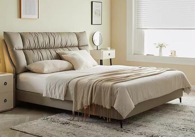 Minimalist genuine leather double bed, cloud-like style, modern and simple design, suitable for small-sized living space, main bedroom in cream color tone.
