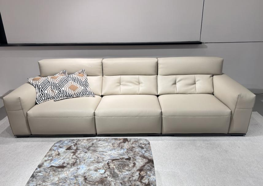 A minimalist three-seater sofa arranged in a straight line for the living room. It is a leather sofa suitable for home use and is designed for small-sized rooms.